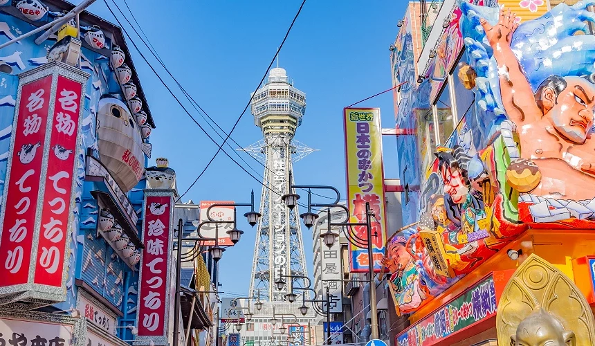 通天阁与新世界商店街的缤纷街景,招牌林立、色彩鲜明,展现大阪独特的庶民文化魅力。