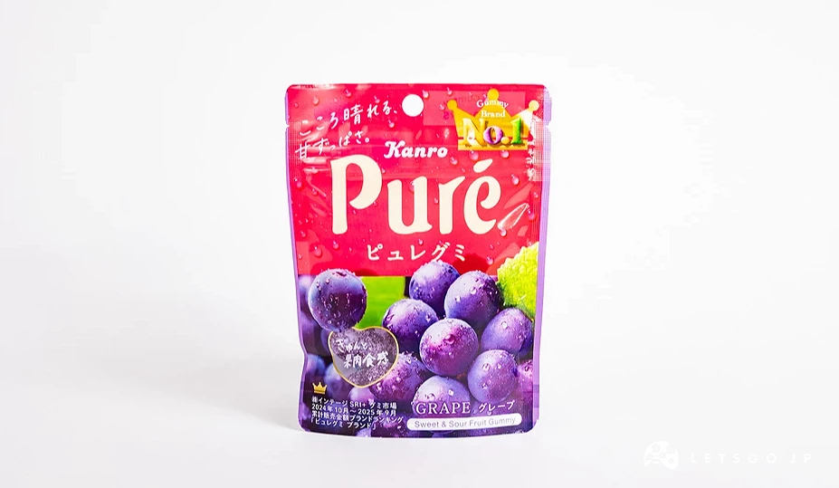 桃红色渐层包装袋,印有 Pure 字样与一串紫葡萄图案