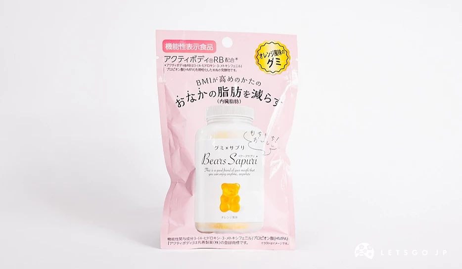 粉色包装袋,印有白色药罐与一只黄色小熊软糖图案