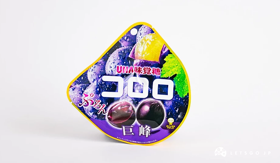 深紫色半圆形包装袋,印有コロロ字样与巨峰葡萄图案